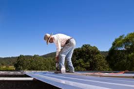 Man working on Metal Carport Roof